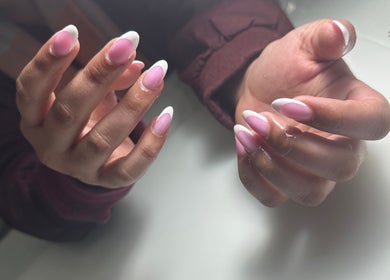 Elegant pink French manicure at South Nail & Beauty Studio, Glasgow, Scotland, GB showcasing a refined style.