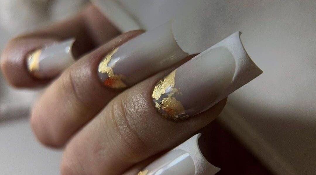 Elegant nails with gold accents at NAVY NAIL HAIR BEAUTY STUDIO in Glasgow, Scotland, GB.
