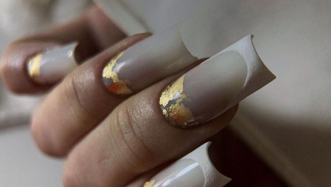 Exquisite gold-accented nails at NAVY NAIL HAIR BEAUTY STUDIO, Glasgow, Scotland, GB showcasing luxury nail art.