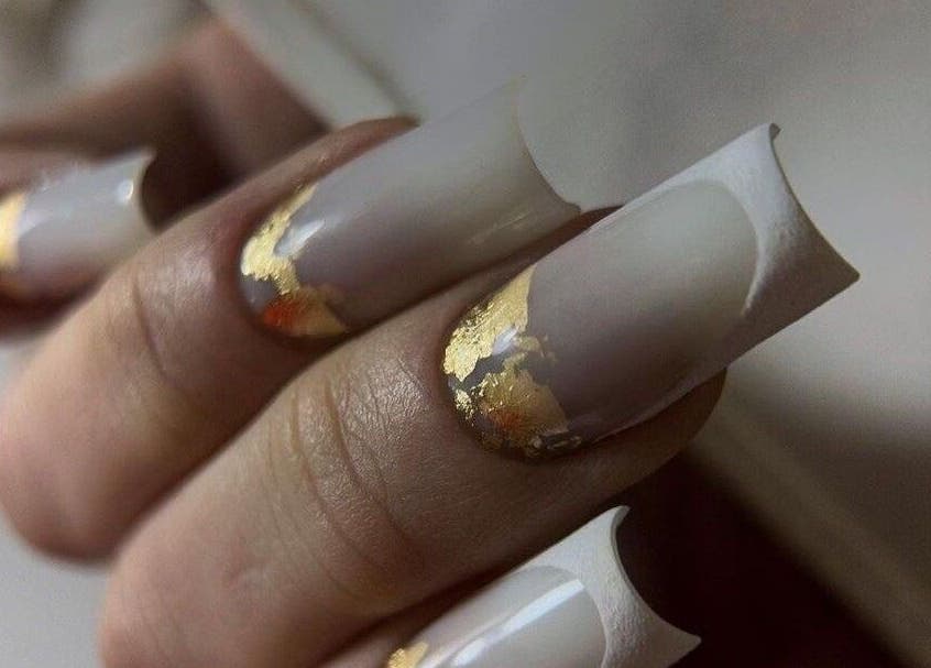 Exquisite gold-accented nails at NAVY NAIL HAIR BEAUTY STUDIO, Glasgow, Scotland, GB showcasing luxury nail art.