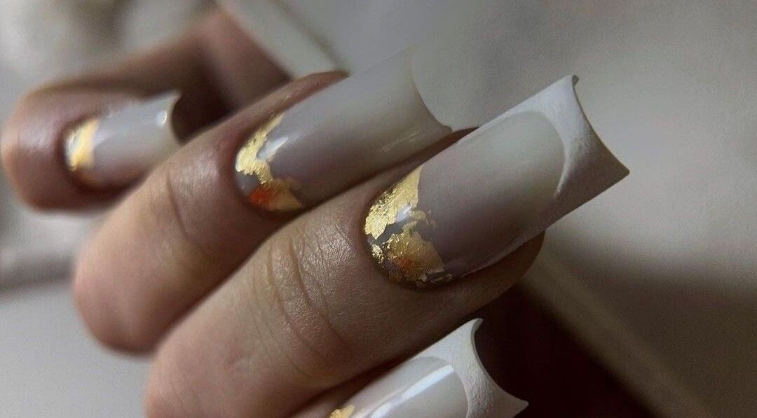 Exquisite gold-accented nails at NAVY NAIL HAIR BEAUTY STUDIO, Glasgow, Scotland, GB showcasing luxury nail art.