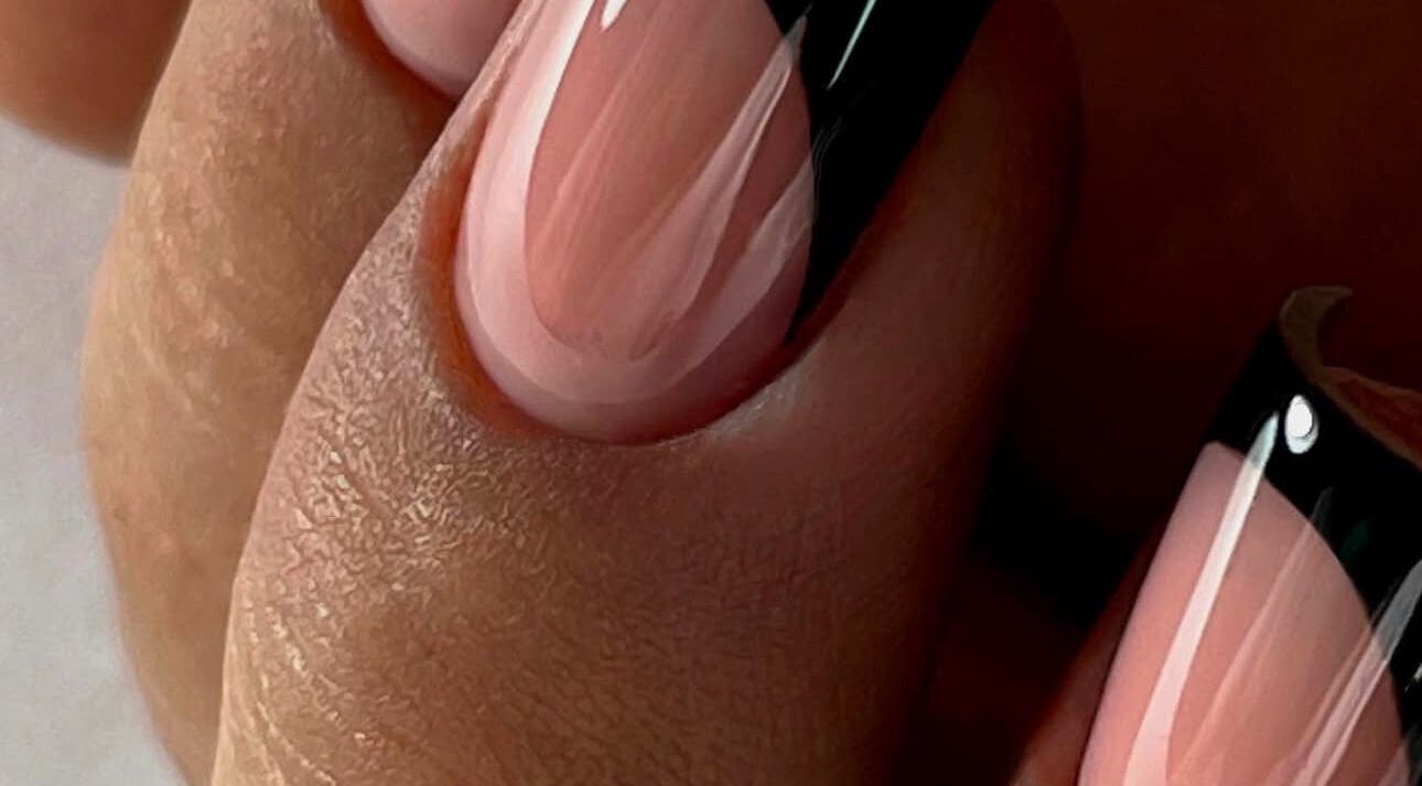 Elegant black-tipped nails at NAVY NAIL HAIR BEAUTY STUDIO in Glasgow, Scotland, GB.