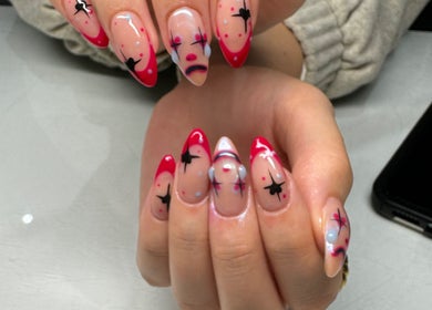 Unique nail art design at Flo’s Beauty, Thurmaston, England, GB showcasing vibrant colors and creative patterns.