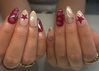 Elegant nail art with stars at Flo’s Beauty, Thurmaston, England, GB. Perfect for a chic look.