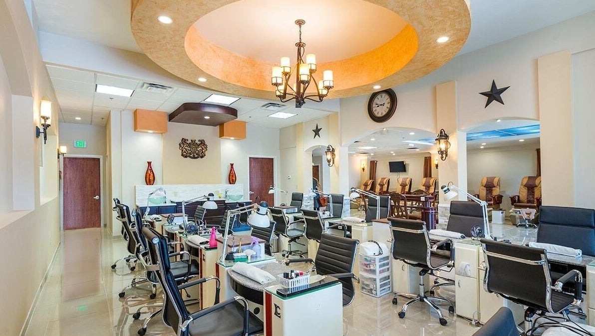 Bright, modern TT Nail Lounge interior in Colorado Springs, Colorado, US with sleek nail stations and plush seating.