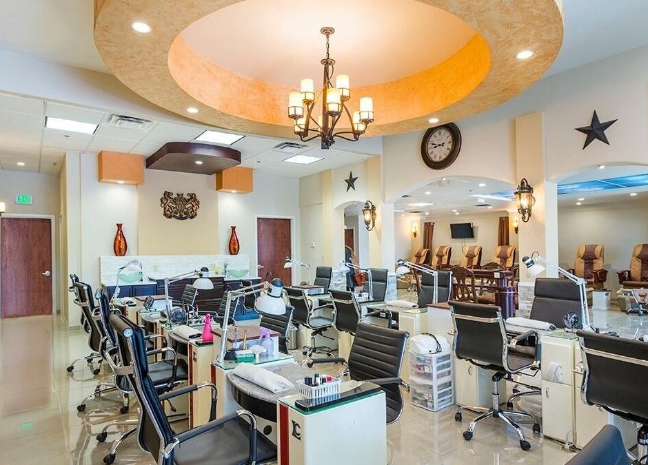 Bright, modern TT Nail Lounge interior in Colorado Springs, Colorado, US with sleek nail stations and plush seating.