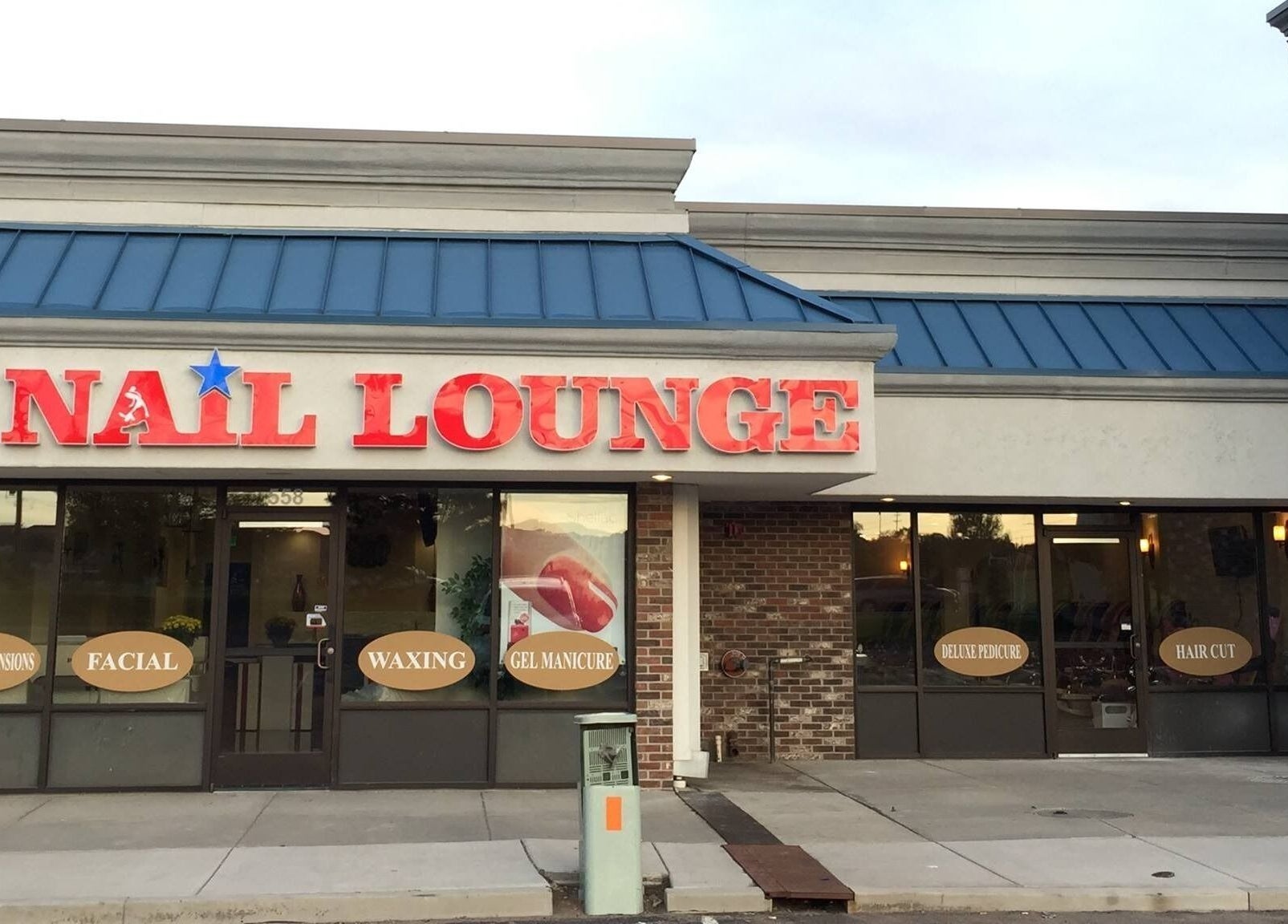 Front view of TT Nail Lounge in Colorado Springs, Colorado, US, showcasing inviting entrance and signage.