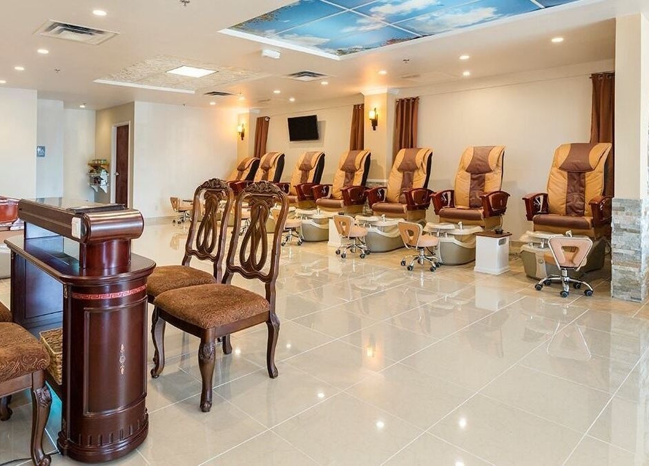 Spacious interior of TT Nail Lounge in Colorado Springs, Colorado, US featuring elegant pedicure chairs.