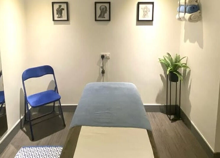 Peaceful treatment room at Re Balance, Redditch, England, GB with massage bed and calming decor.