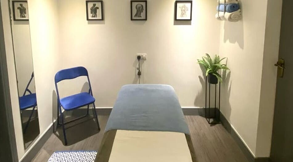 Peaceful treatment room at Re Balance, Redditch, England, GB with massage bed and calming decor.