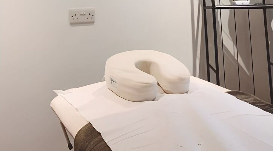 Relaxing massage table at Re Balance in Redditch, England, GB, offering a tranquil wellness experience.