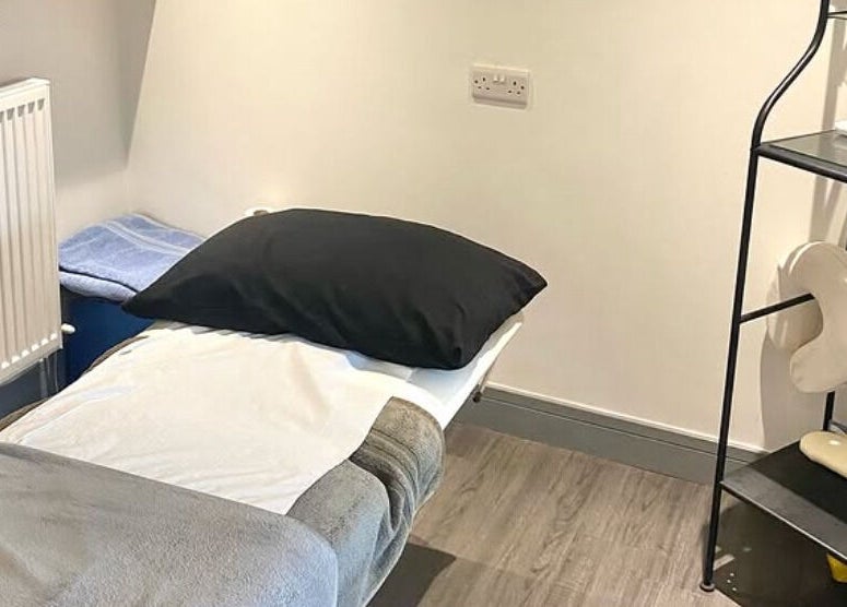 Massage room at Re Balance in Redditch, England, GB with a comfortable bed and calming decor.