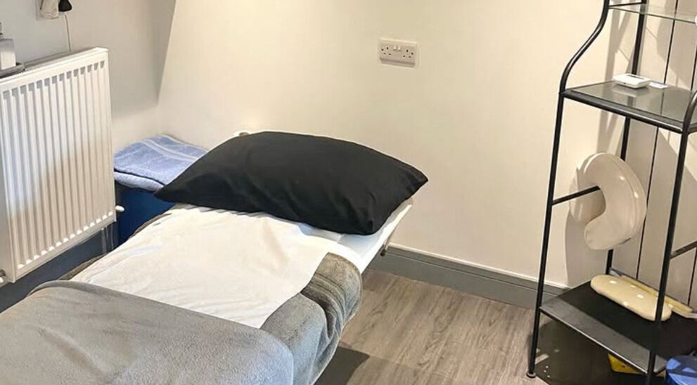 Massage room at Re Balance in Redditch, England, GB with a comfortable bed and calming decor.