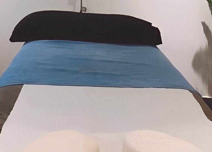 Cozy massage bed at Re Balance, Redditch, England, GB, offering a calming wellness experience.