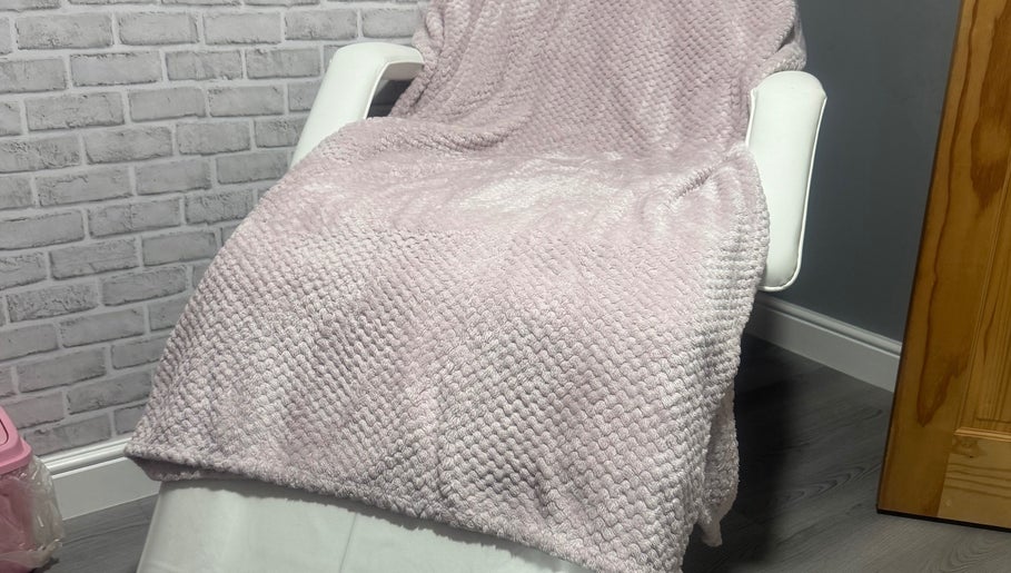 Relaxing treatment chair with plush blanket at Unique Aesthetics, Ironville, England, GB.