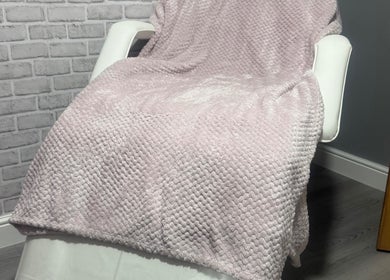 Relaxation chair with soft pink blanket at Unique Aesthetics, Ironville, England, GB.