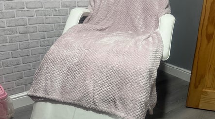 Relaxation chair with soft pink blanket at Unique Aesthetics, Ironville, England, GB.