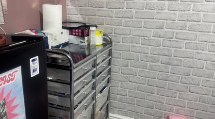 Modern storage with beauty essentials at Unique Aesthetics, Ironville, England, GB. Sleek design and functionality.
