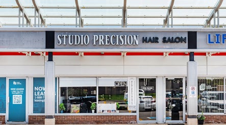 Exterior view of Studio Precision Hair Salon in Burlington, Ontario, CA, showcasing its elegant facade.