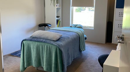 Relaxing therapy room at CQ Massage Therapy, City Of Wanneroo, Western Australia, AU, with a massage bed.