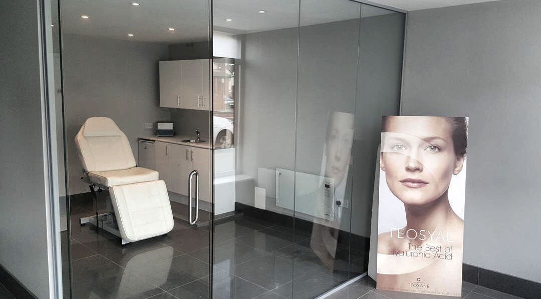 Modern treatment room at Kerrie Lynch Aesthetics, Manchester, England, GB, featuring a sleek chair and calming decor.