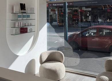 Modern lounge area at Soraya Skin Clinic Prahran, Prahran, Victoria, AU, with street view through large window.
