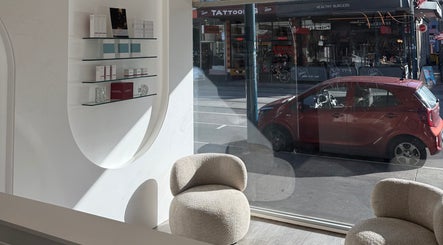 Modern lounge area at Soraya Skin Clinic Prahran, Prahran, Victoria, AU, with street view through large window.