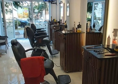 Sleek interior of Barber Shop Labi in Prishtina, XK, showcasing modern chairs and styling stations.