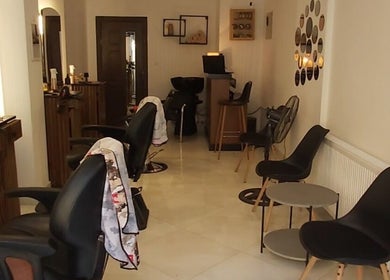 Chic interior of Barber Shop Labi, Prishtina, XK with sleek chairs and stylish decor.
