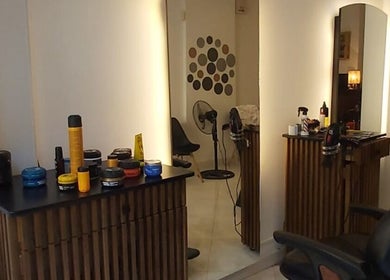Modern salon interior at Barber Shop Labi, Prishtina, XK, showcasing well-organized grooming products.