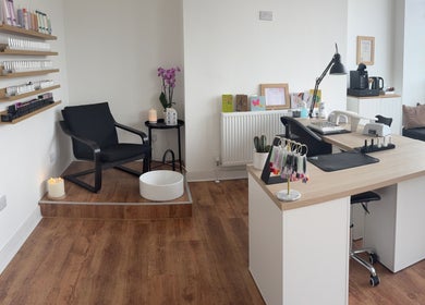 Modern manicure station at EmHanced Nails in Shipley, England, GB, showcasing sleek design and cozy ambiance.