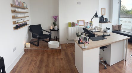 Inviting nail salon interior at EmHanced Nails, Shipley, England, GB with modern decor and comfortable seating.