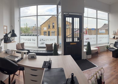 Bright, inviting interior of EmHanced Nails in Shipley, England, with elegant decor and workstations.