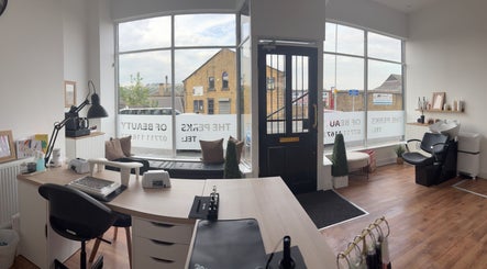 Bright, inviting interior of EmHanced Nails in Shipley, England, with elegant decor and workstations.