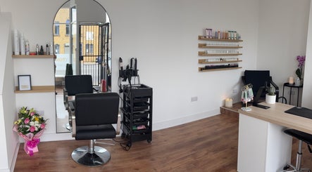 Elegant interior of EmHanced Nails, Shipley, England, GB featuring modern salon setup and nail polish display.