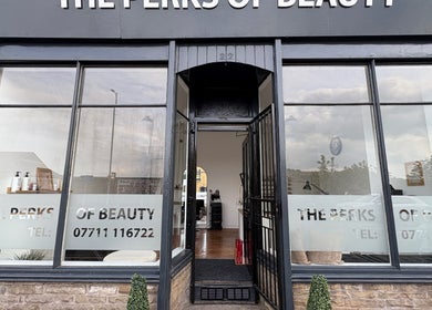 Entrance of EmHanced Nails, Shipley, England, GB with stylish black decor and inviting open door.