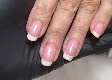Elegant French manicure by EmHanced Nails, Shipley, England, GB. Perfect pink polish with white tips.