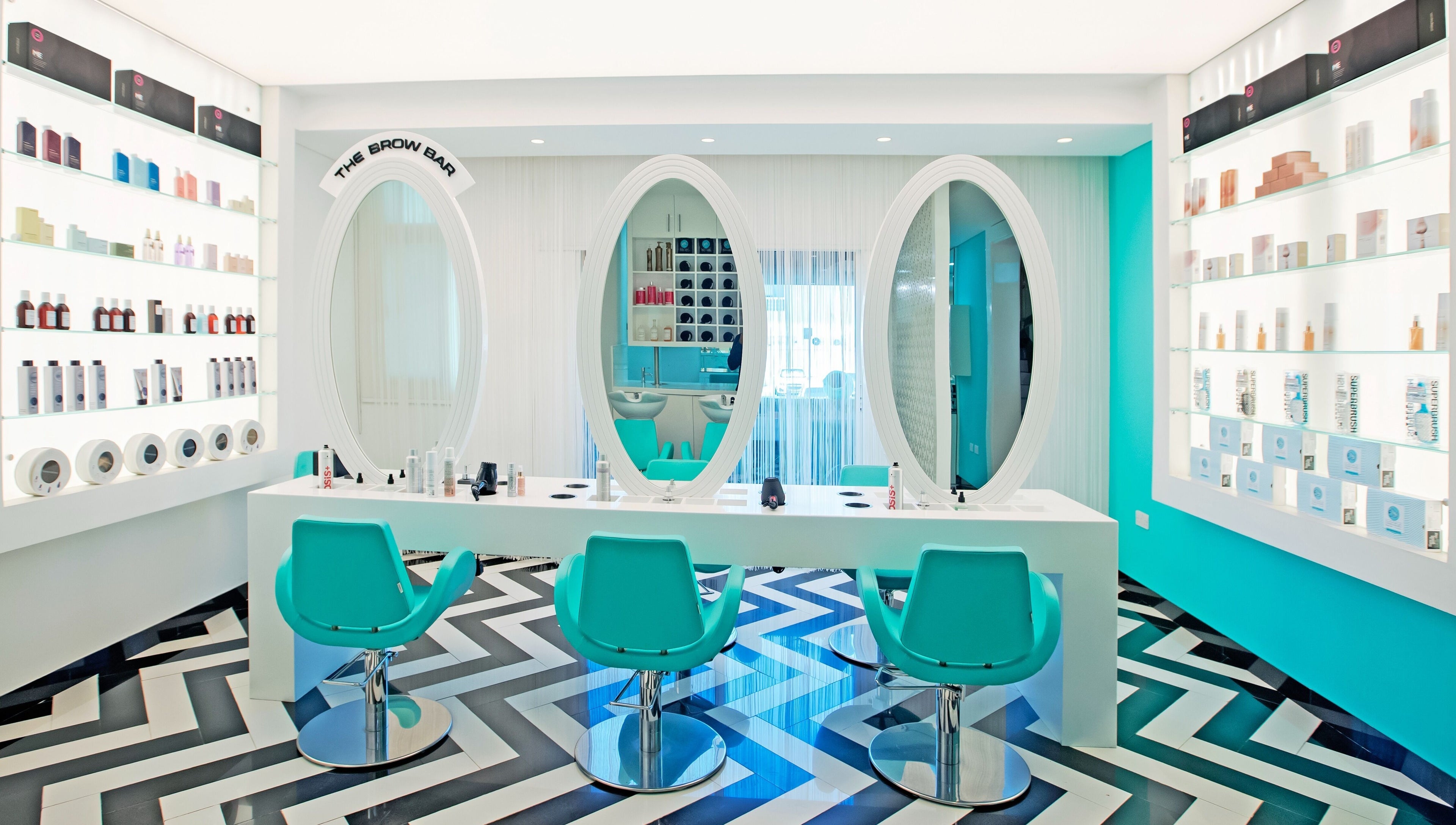 Inside House Of Allure Beauty And Spa, Abu Dhabi. Elegant styling chairs and mirrors create a stylish atmosphere.