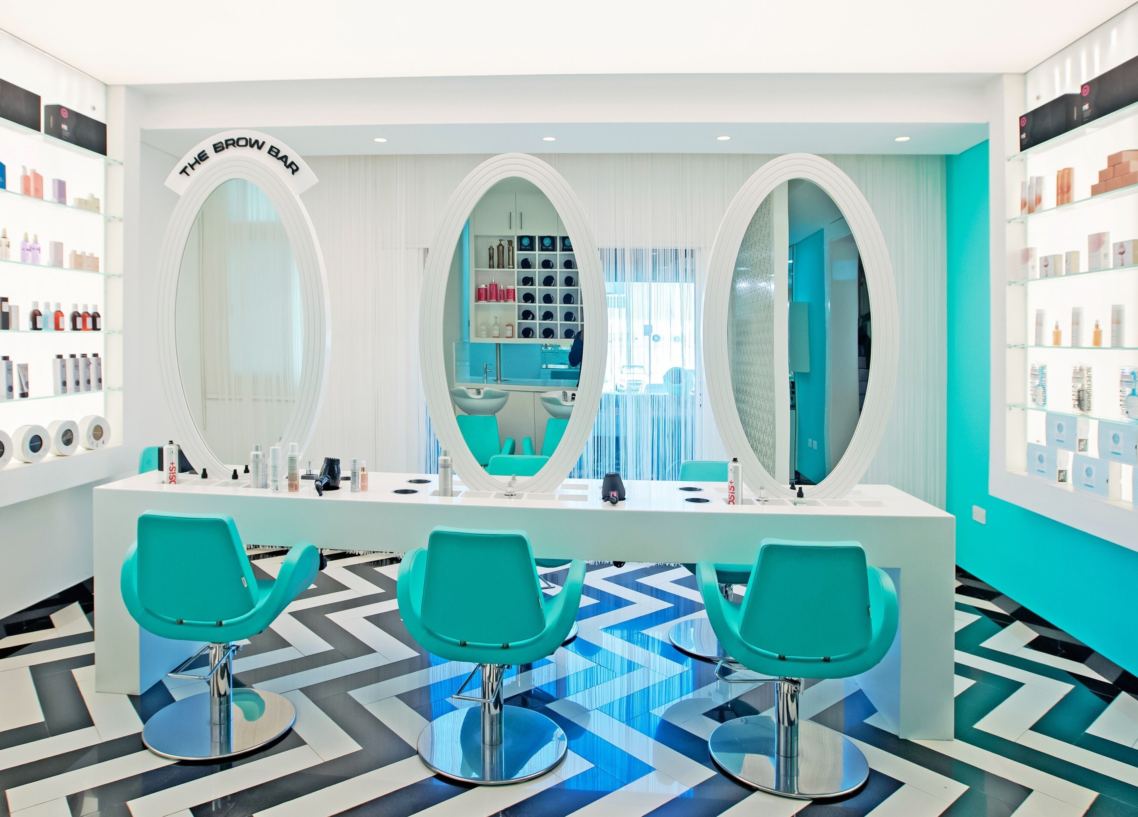Inside House Of Allure Beauty And Spa, Abu Dhabi. Elegant styling chairs and mirrors create a stylish atmosphere.