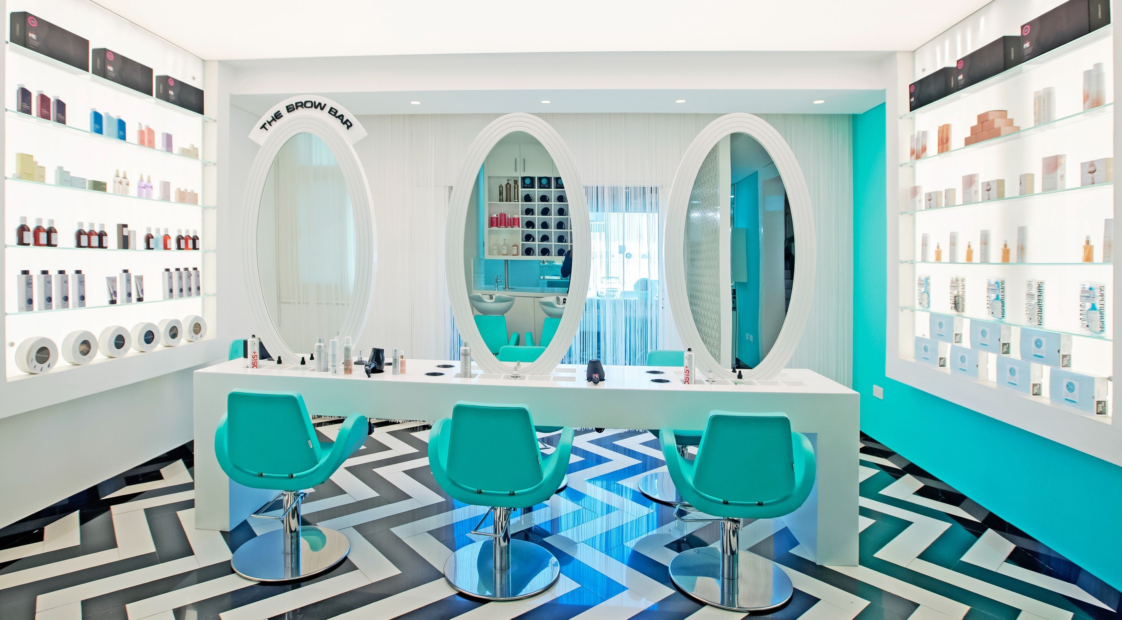 Inside House Of Allure Beauty And Spa, Abu Dhabi. Elegant styling chairs and mirrors create a stylish atmosphere.
