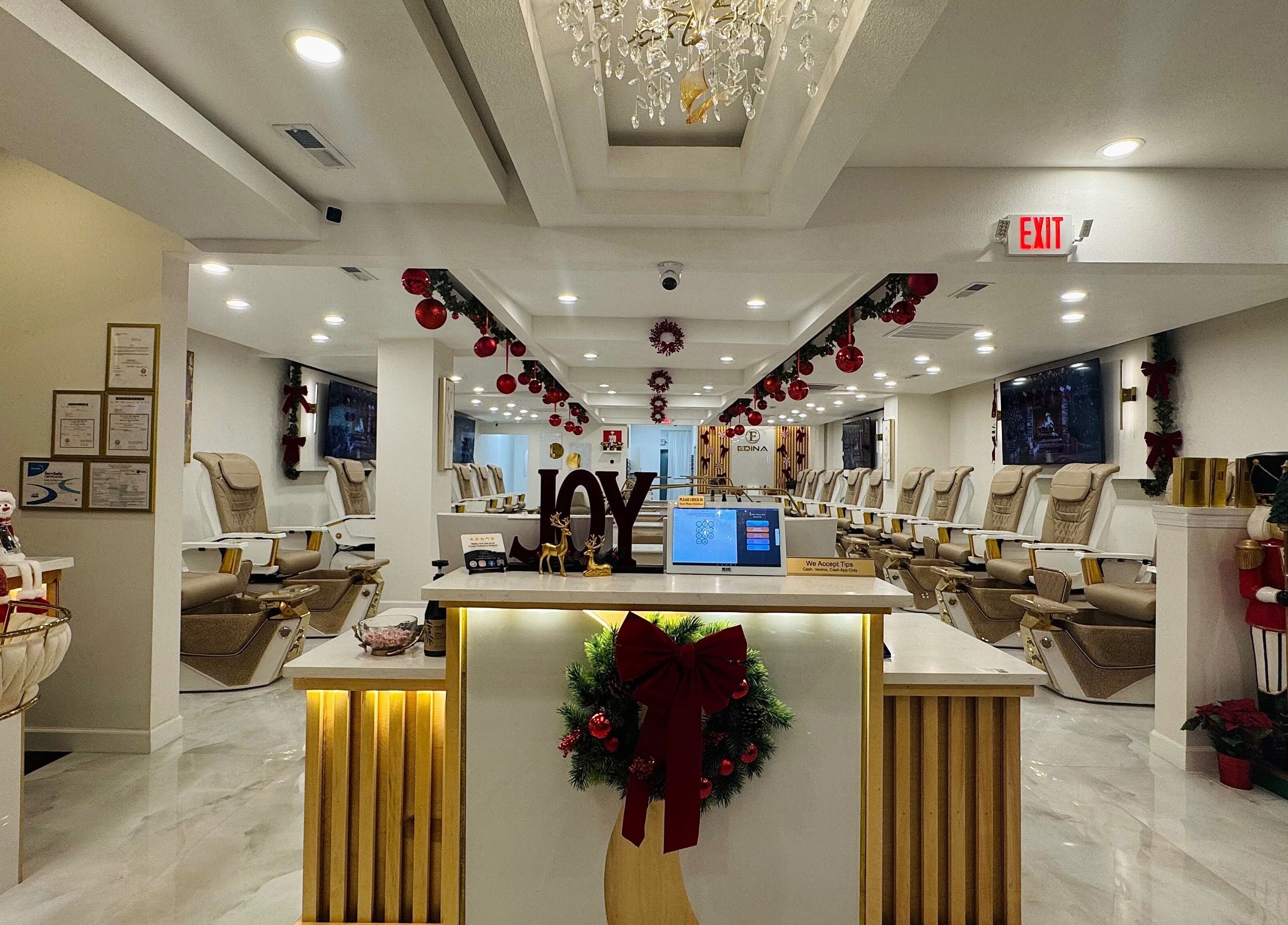 Interior of Edina Nails Spa decorated festively in Delaware, Ohio, US with elegant seating and joyful decor.