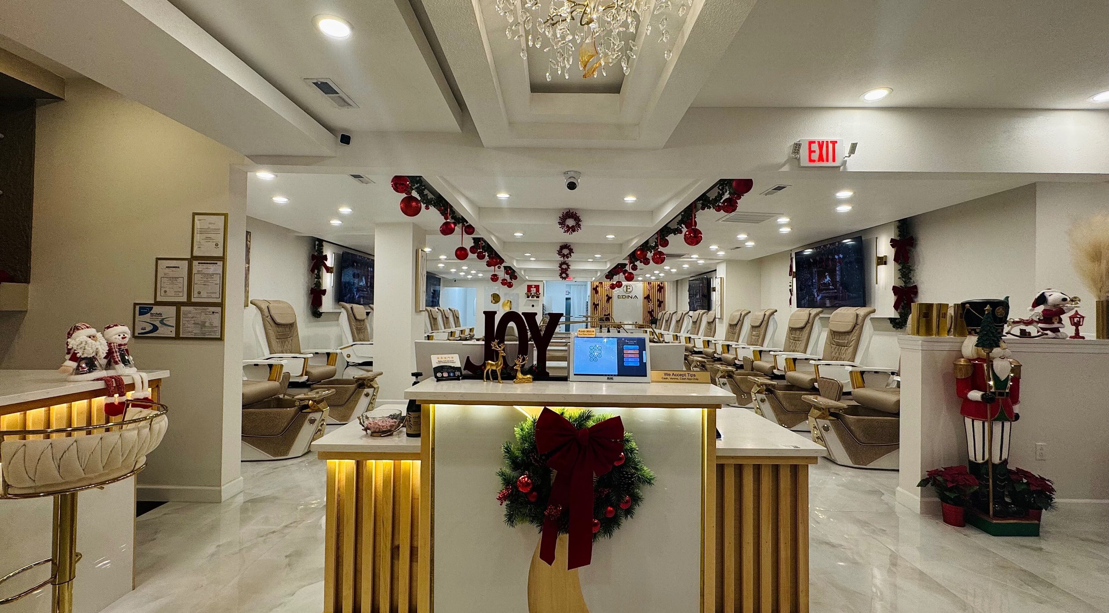 Interior of Edina Nails Spa decorated festively in Delaware, Ohio, US with elegant seating and joyful decor.