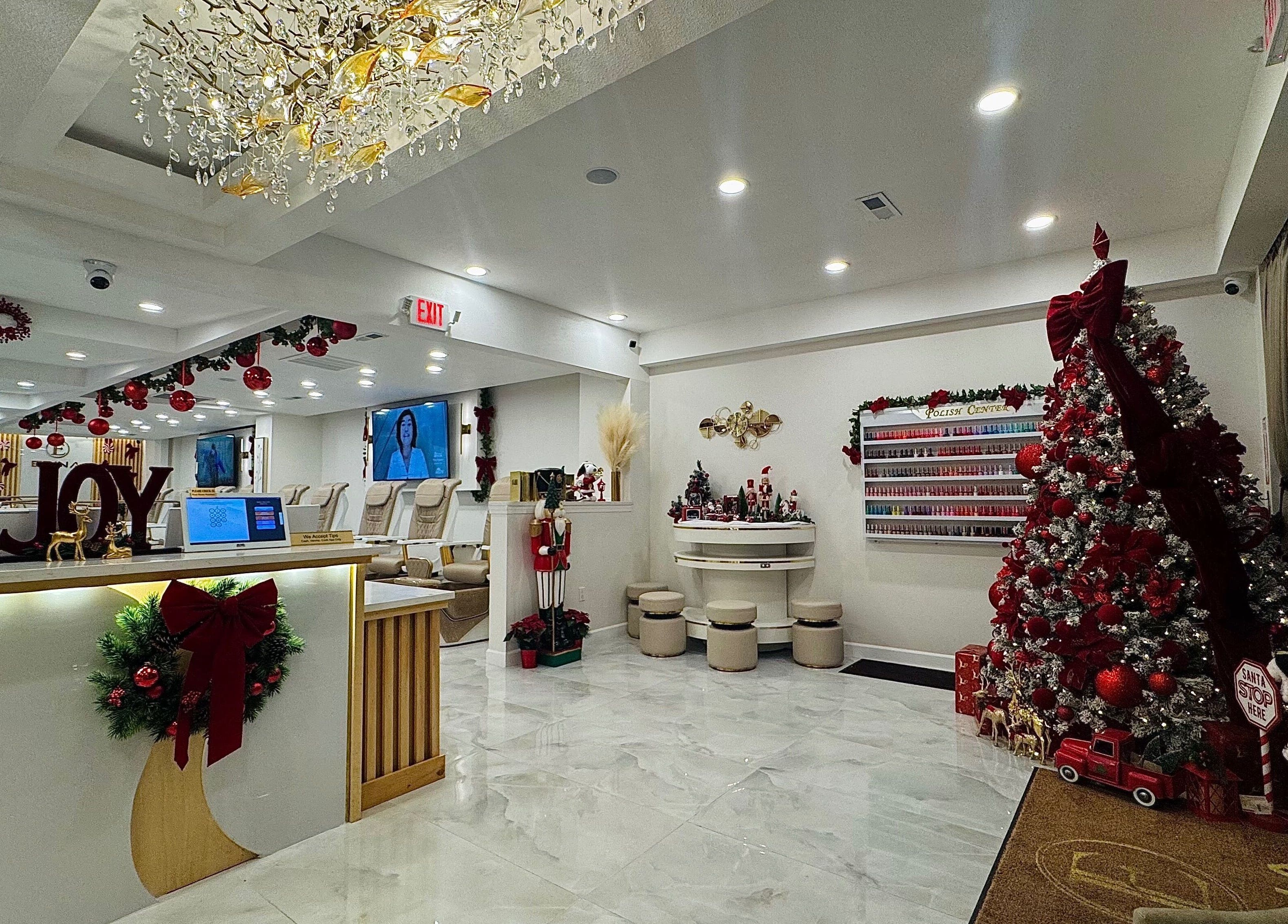Holiday decor at Edina Nails Spa in Delaware, Ohio, US, featuring a Christmas tree and festive decorations.