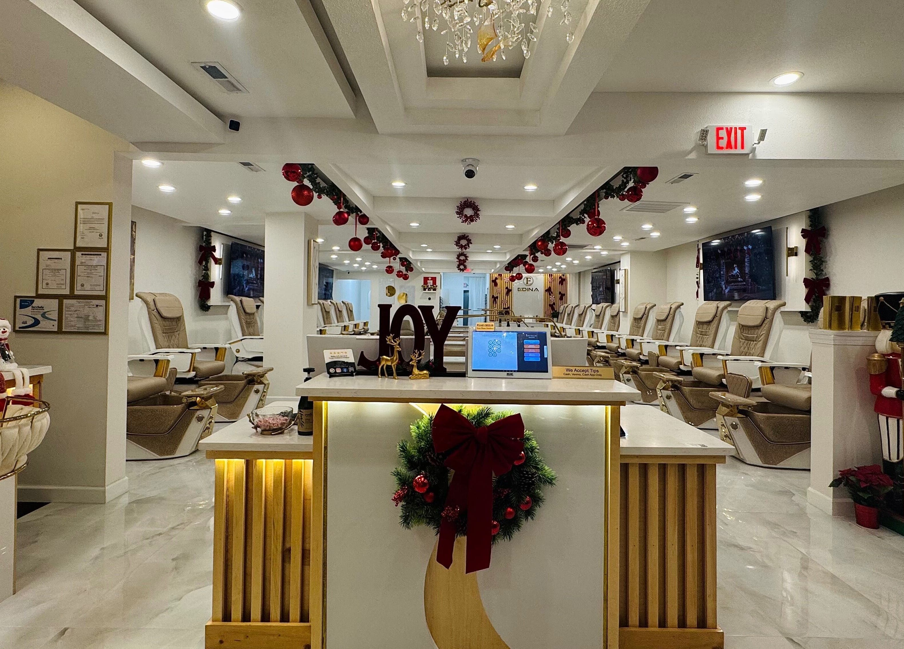 Edina Nails Spa interior with festive decor and comfortable seating in Delaware, Ohio, US.