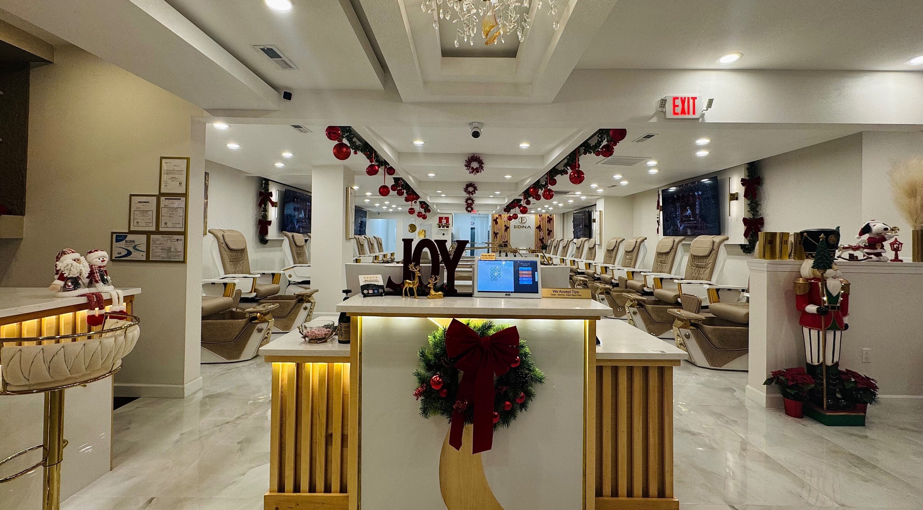 Edina Nails Spa interior with festive decor and comfortable seating in Delaware, Ohio, US.
