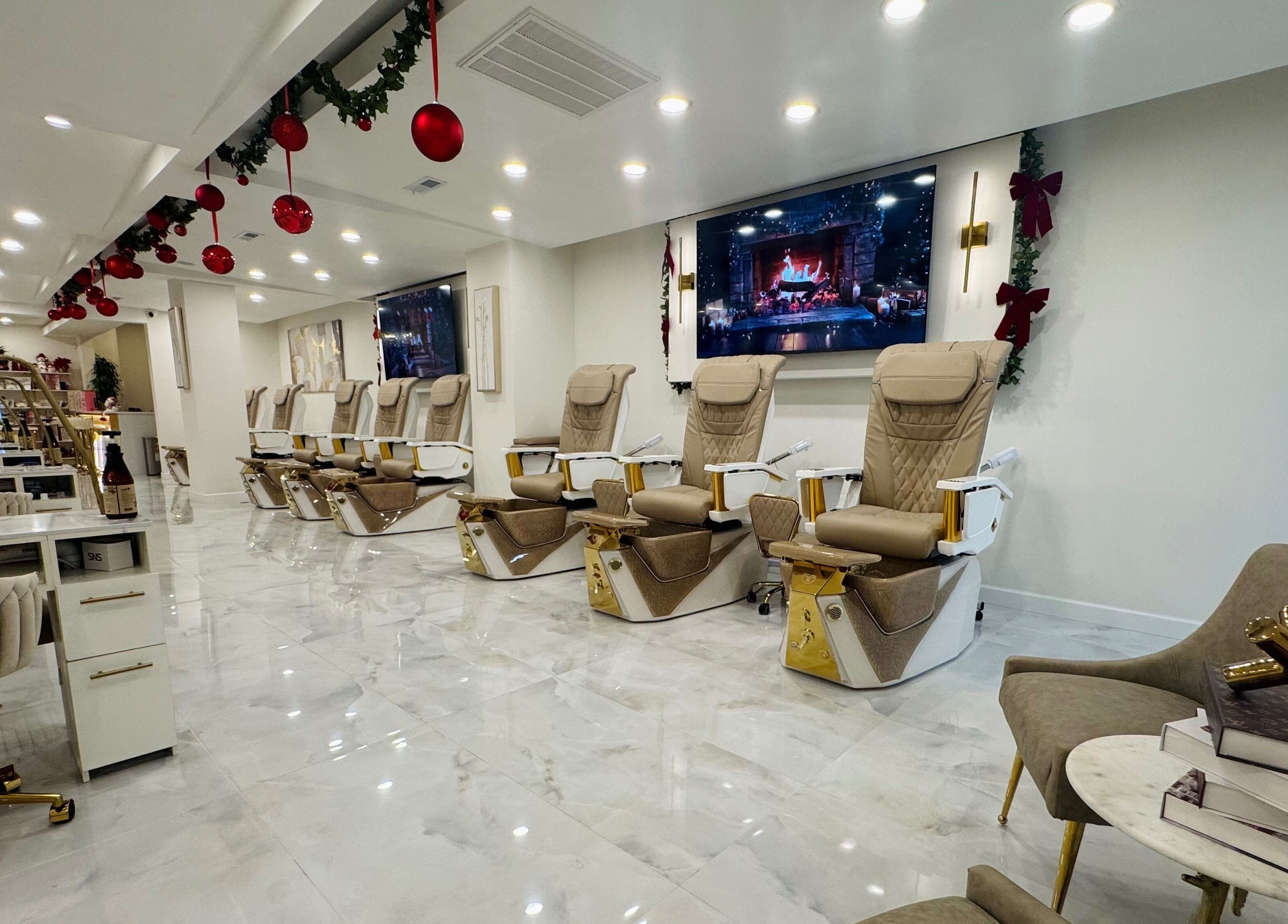 Luxurious pedicure chairs at Edina Nails Spa, Delaware, Ohio, US, under festive red decorations.