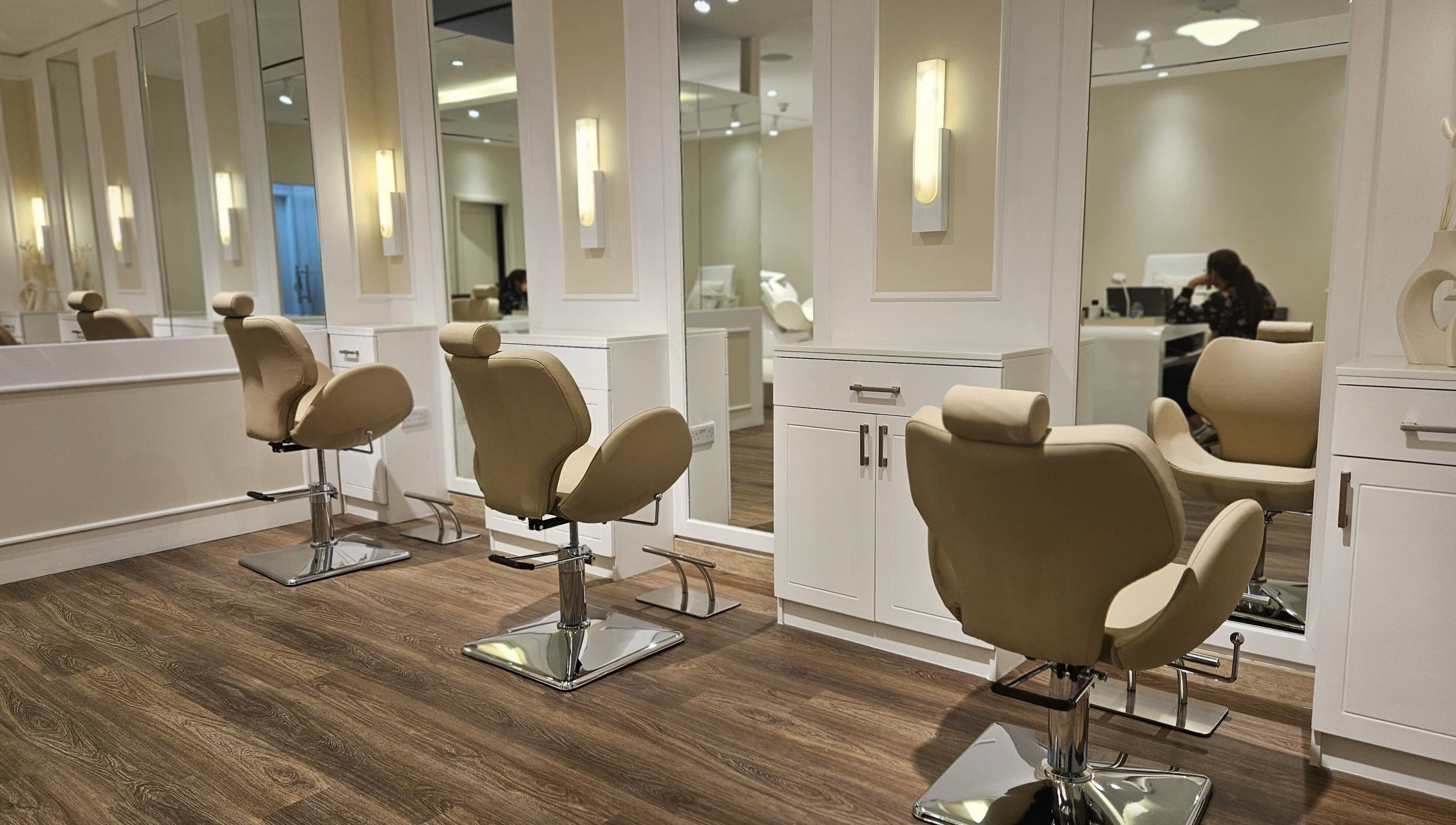 Spacious and modern salon chairs at Cattleya Beauty Salon, Dubai, AE, offering a serene beauty experience.