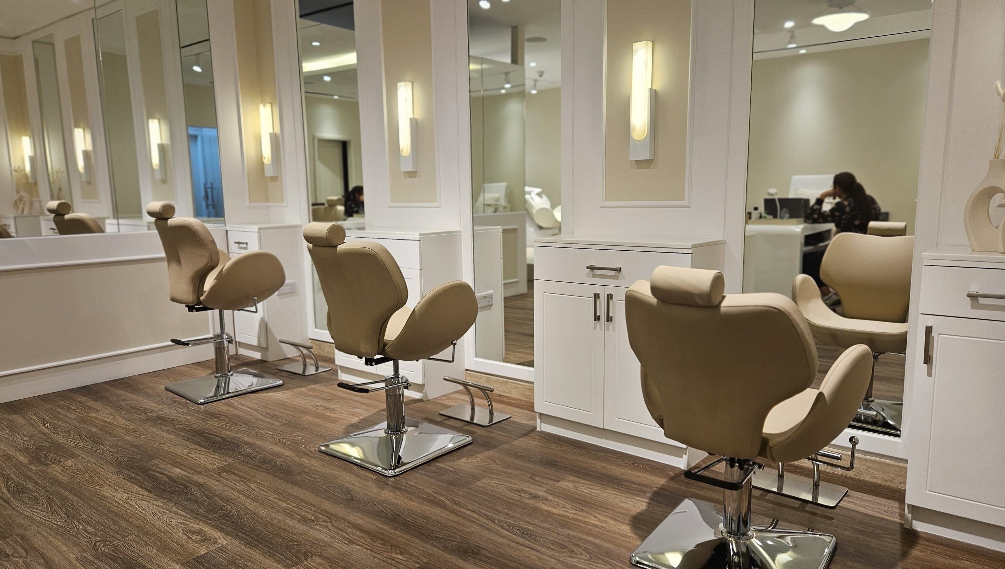 Spacious and modern salon chairs at Cattleya Beauty Salon, Dubai, AE, offering a serene beauty experience.