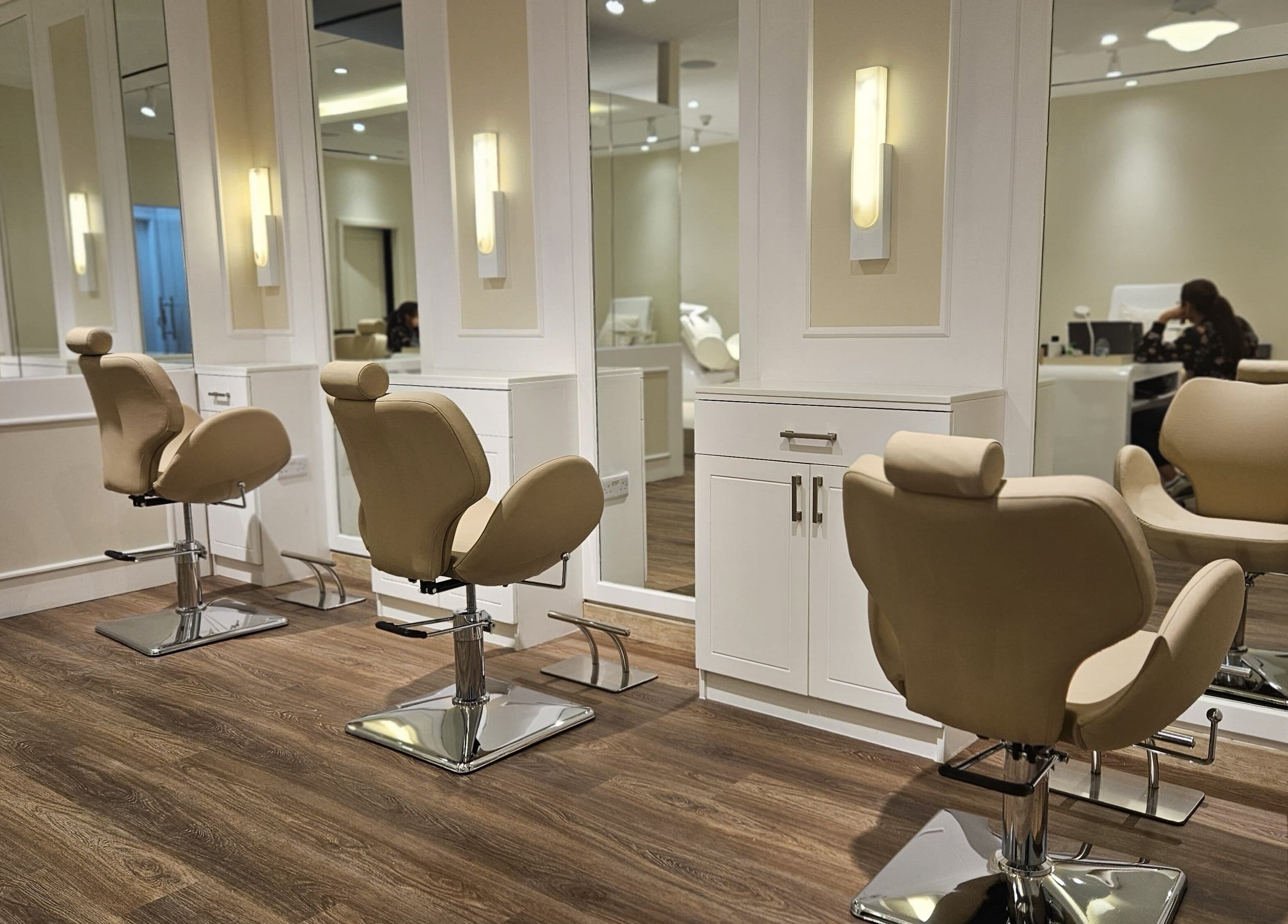 Spacious and modern salon chairs at Cattleya Beauty Salon, Dubai, AE, offering a serene beauty experience.