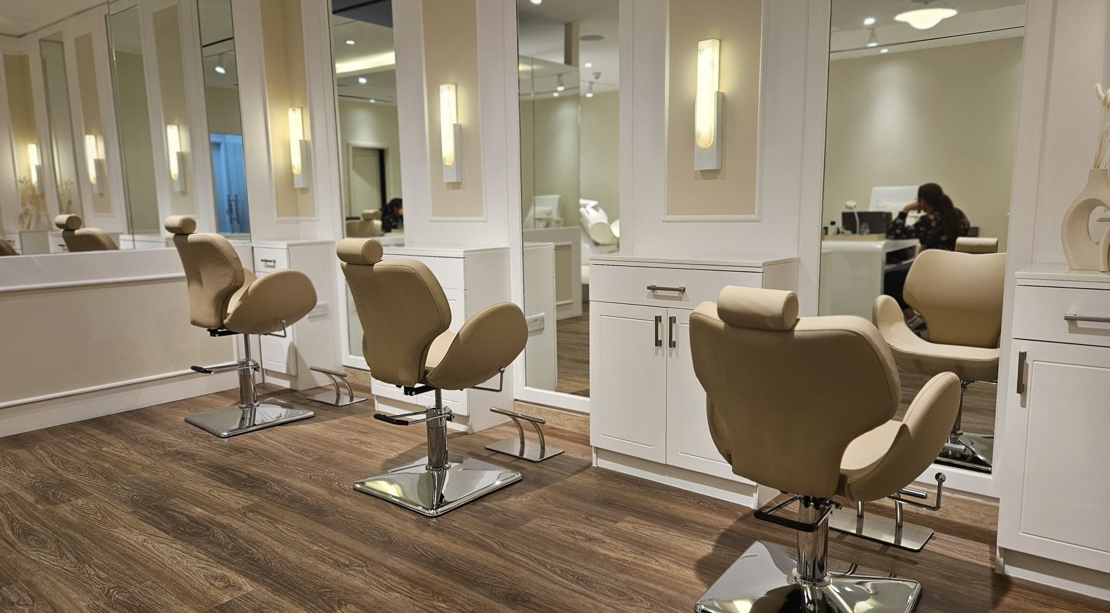 Spacious and modern salon chairs at Cattleya Beauty Salon, Dubai, AE, offering a serene beauty experience.